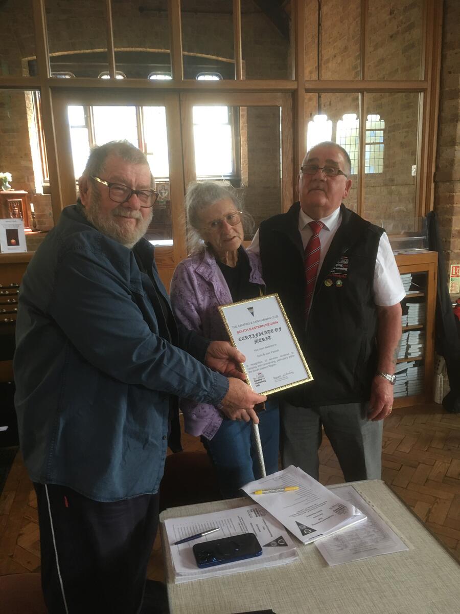 Joan and Colin receiving their certificate of merit from Alan Armstrong chairman of south eastern region for their hard work for the DA and the region over the years