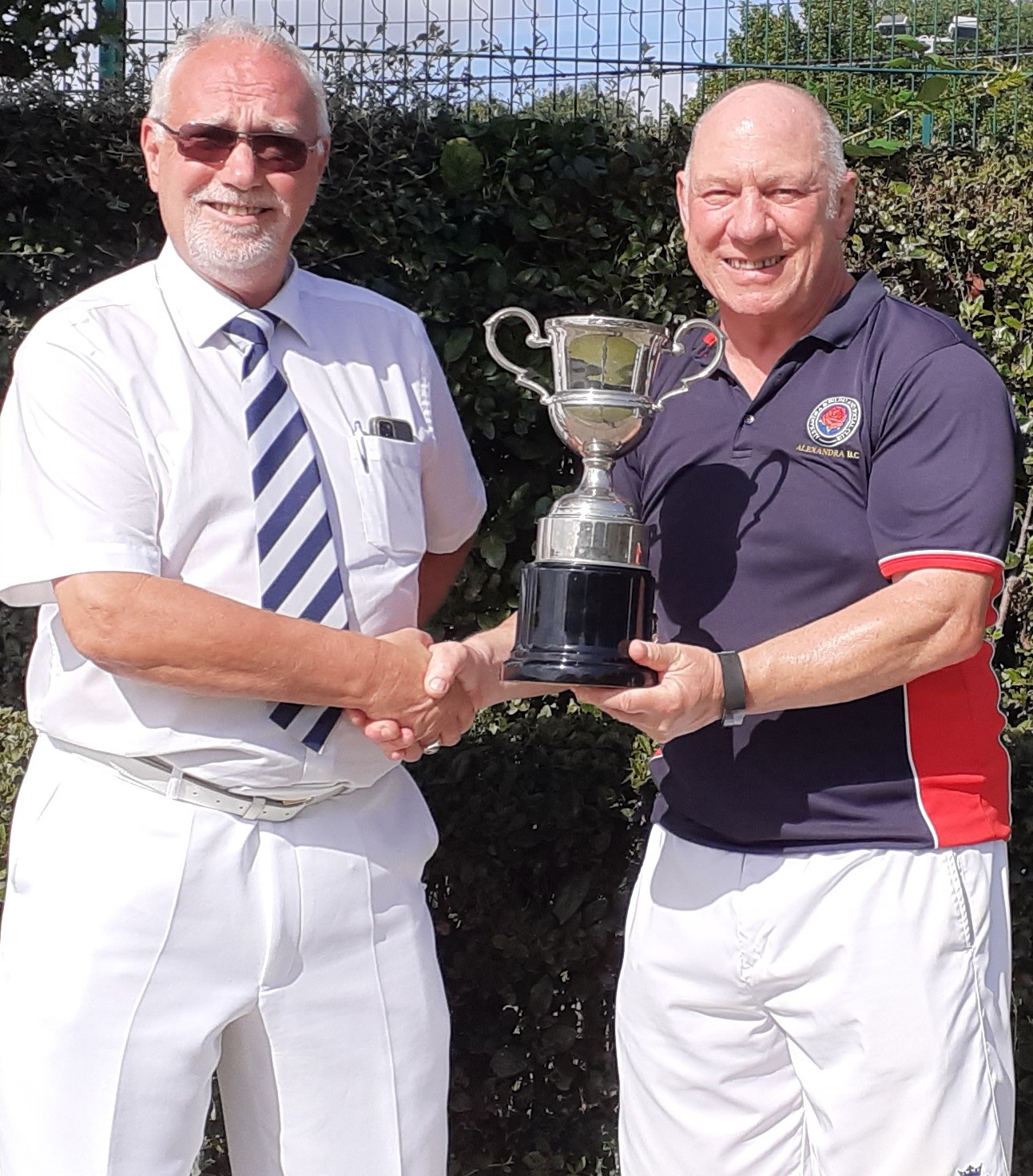 Simon Batcheler, Acting P&D Competitions Secretary, presents the Champion of Champions Trophy to Jamie Cook