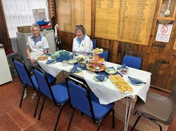 Ready for tea - Table 3 (Rosemary and Juliette eyeing up the scones)