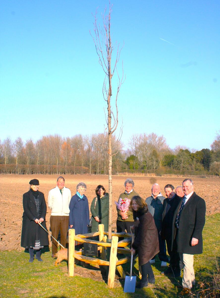 The Lord Lieutenant of Kent, the Lady Colgrain looked on by local landowners, members of the parish council and parish as she dedicates the first Columnar Oak to her Late Majesty, the Queen Elizabeth II