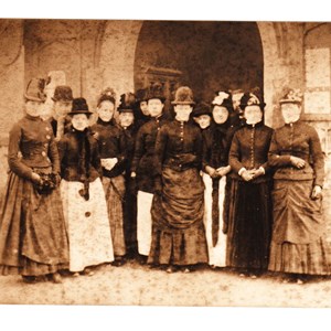 Spectators at a wedding poss late 1880s