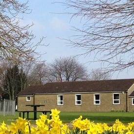 View of Hall with daffodils by the West Street wall