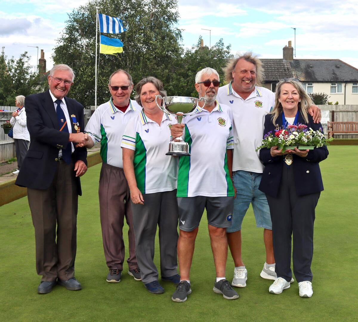 Chairman Charlie Underwood congratulates winners John Holroyd, Moira Holroyd, Captain Graham Patrickson and Paul Bailey, with President Rita Downs.