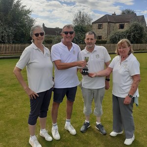 Mixed pairs runners up Liz Dyer & Tony Ansell presenting trophy to winners Jonny Abbott & Jeannie Hutton