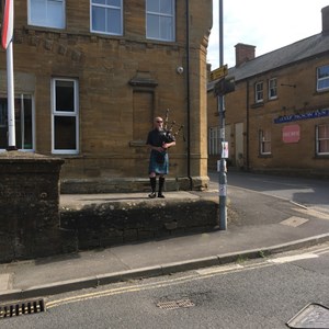 Playing the Bagpipes outside the Stoke Working Men's Club