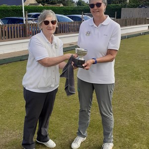 Ladies club champion Liz Dyer (on right) receiving trophy from runner up Colleen Laker