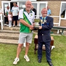 President Dusty Miller presents captain Paul Murrant with the trophy