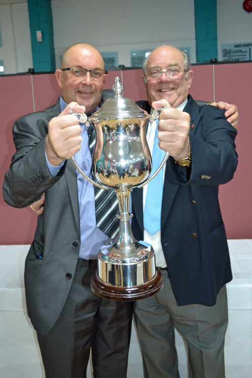 Trevor Upchurch & Colin Childs hold aloft the Stevenage Mixed League Trophy Trevor Upchurch & Colin Childs hold aloft the Stevenage Mixed League Trophy