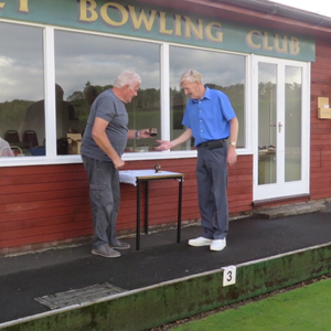 Presentation of Covid-19 triples trophy to No 2 Dave Pearson