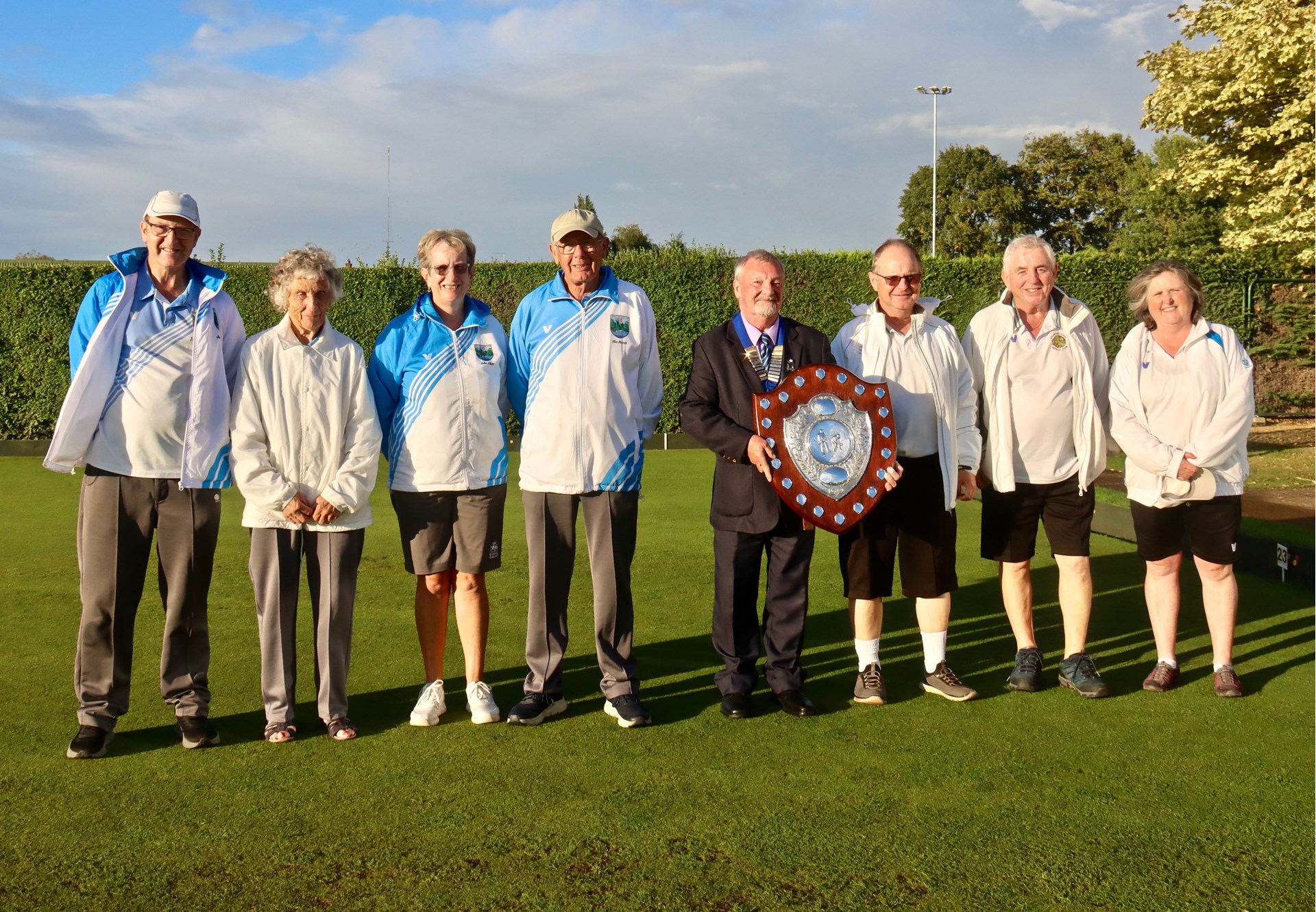 Left to right: runners-up  Julian Wheel, Val Thompson, Julie Allen and Alec March, President Dusty Miller presenting the shield, winners John Holroyd, Kevin Vinter and Moira Holroyd