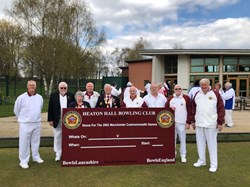 Heaton Hall bowls committee with new club sign.
