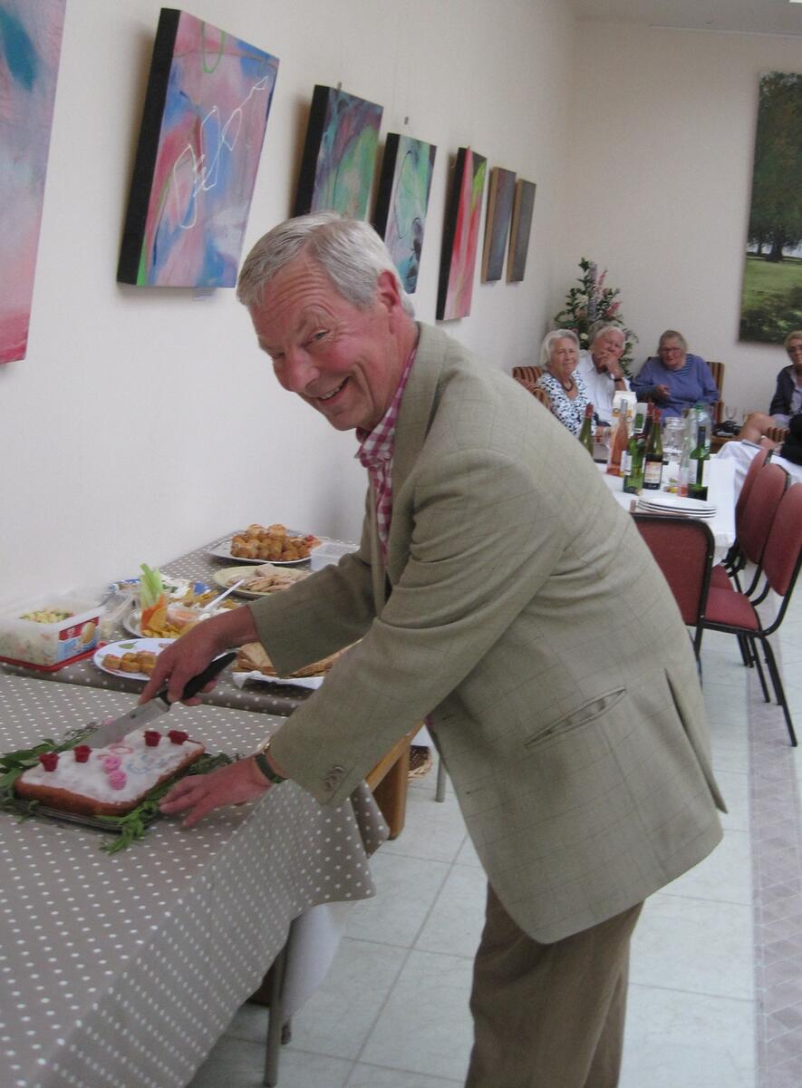 the chairman cuts the cake for the club's 20th birthday the chairman cuts the cake for the club's 20th birthday