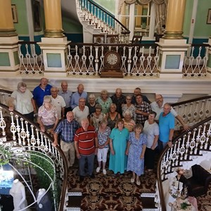 Whole group on hotel's elaborate stairs