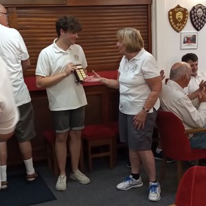 Chris Rawlings receiving the Marko Team Shield on behalf of Tornadoes from Harriers Captain Sue Fleckney