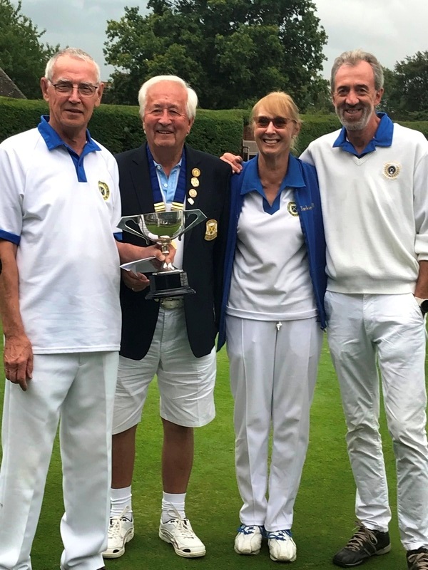 President Terry Atkinson with winners John Bell, Jackie Bell and Barry Woodham