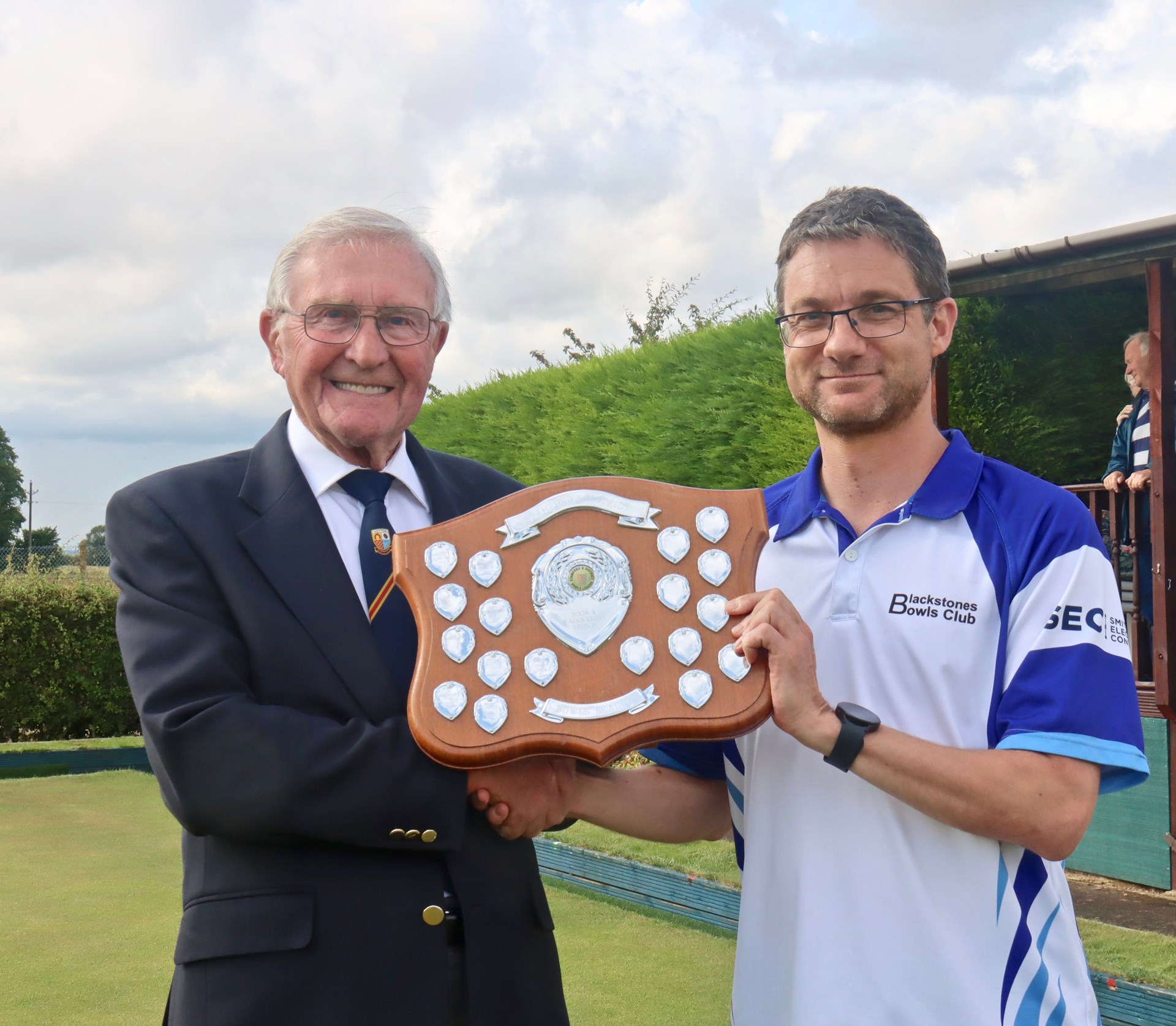 Chairman Charlie Underwood presenting Blackstones C captain Adam Warrington with the Boor & Wainwright Shield