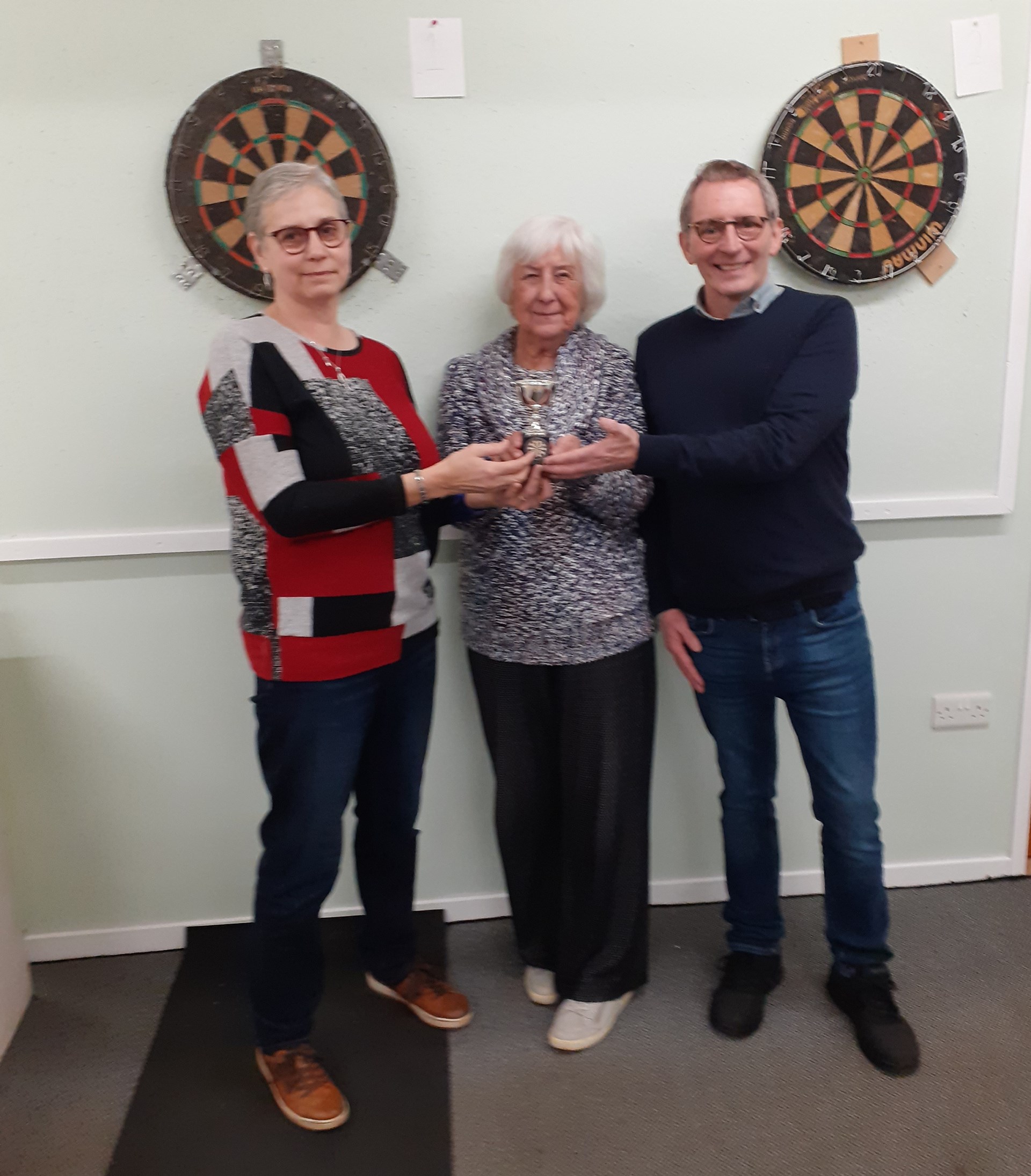 Darts winners 2025 Liz Dyer & James Murphy receiving trophy from President Annette Oliver (Centre)