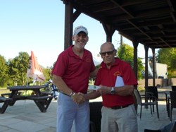 Nigel wins nearest the pin and looks happy about it having just come second in the pairs competition