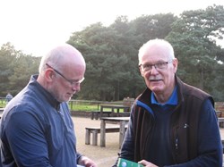 Graham steps in to present the captain with the nearest the pin prize.