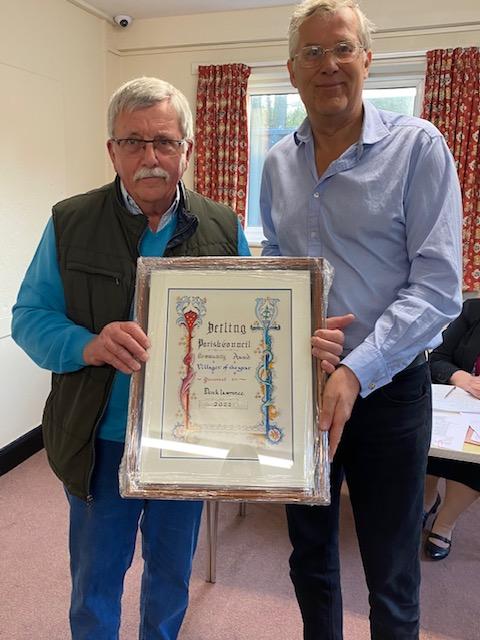 Cllr Geoff Cosgrove, Chairman, presenting Mr Lawrence with the Village of the Year Certificate