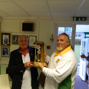 President Bob Peckings presenting Kev Clarke with the Farley Trophy