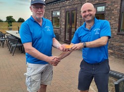 The captain presents the vice captain with the nearest the pin sleeve of balls