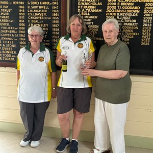 Carol McIldoon in the centre receiving the Jill Meager trophy from Jill herself alongside the event organiser Anne Cook. Carol beat Ann Milne in the final