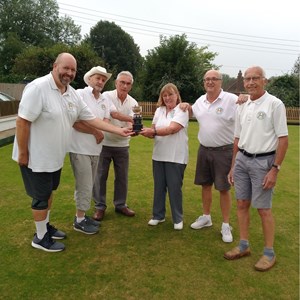 Drawn Triples winners Keith Cusdin, Jonny Abbott, & Roy Hosmer receiving trophy from runners up Jeannie Hutton, Richard Lambert & Gordon Corby