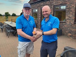 Vice captain presents captain with the runners up sleeve of balls