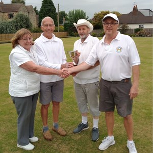 Australian Pairs runners up Jeannie Hutton & Gordon Corby presenting trophy to winners Jonny Abbott & Richard Lambert