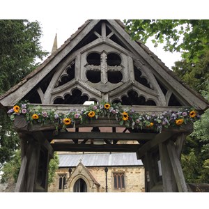 DEC 18th  LYCHGATE (by AH) From 1549 the priest had to meet a corpse at the churchyard entrance so covered gates were built to provide shelter.  Ladbroke's lychgate was given in 1884 in memory of Rev Errington, who had opened the village school.