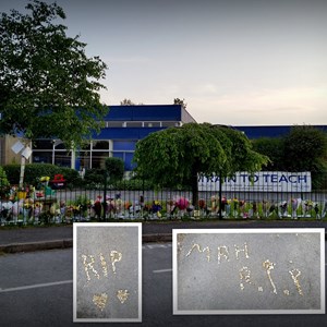It is with sadness that I post this picture. These tributes are beautiful, the stones were placed on Tims parking space