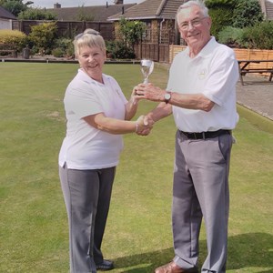 Roy Hosmer receiving the Novice Cup from runner  up Carol Findley