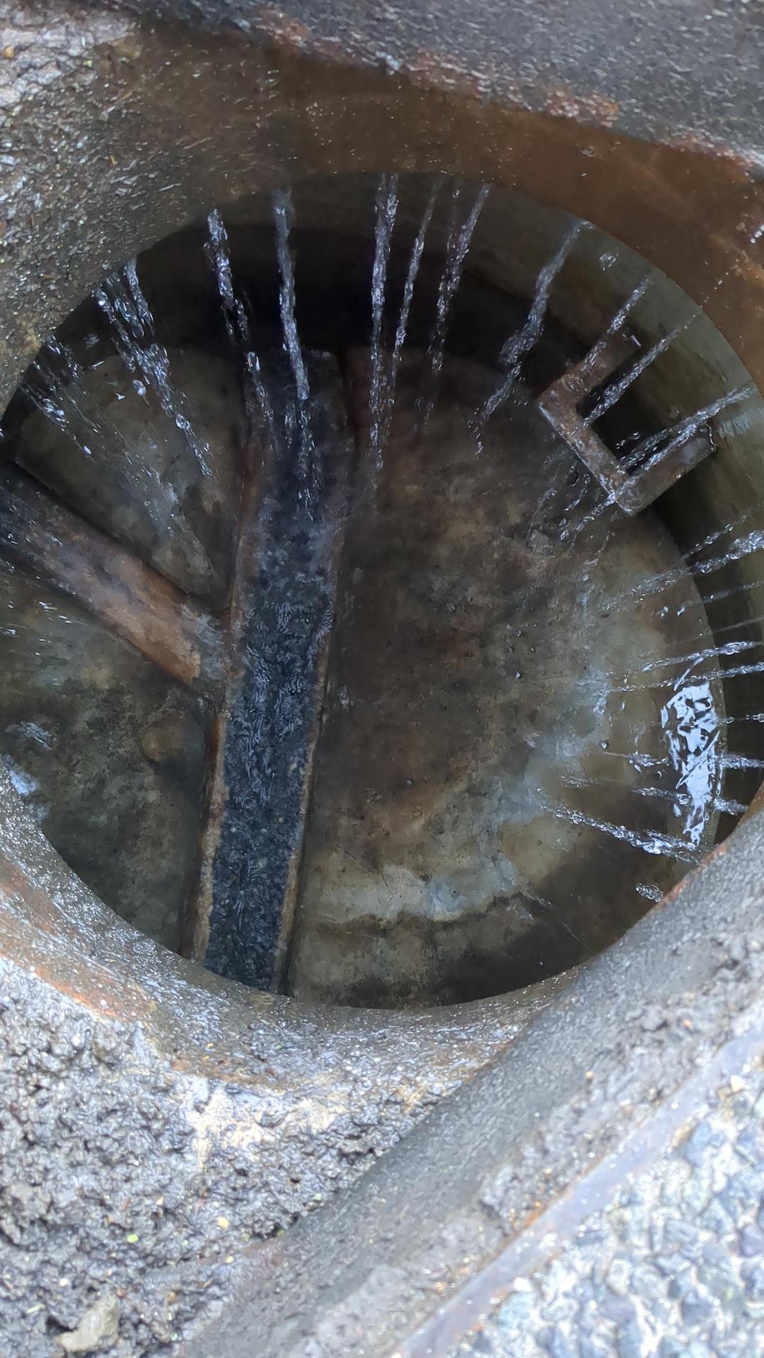 Groundwater infiltrating the brickwork of a manhole