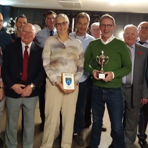 Captain Liz Dyer with winning Melton Triples team 2025 L - R  Jeannie Hutton,  Bruce Acock, Jonny Abbott, Andy Williamson, Jack Warner, Liz, John Cox, Roy Hosmer, James Murphy, John Mitchell, Richard Lambert & Tony Ansell