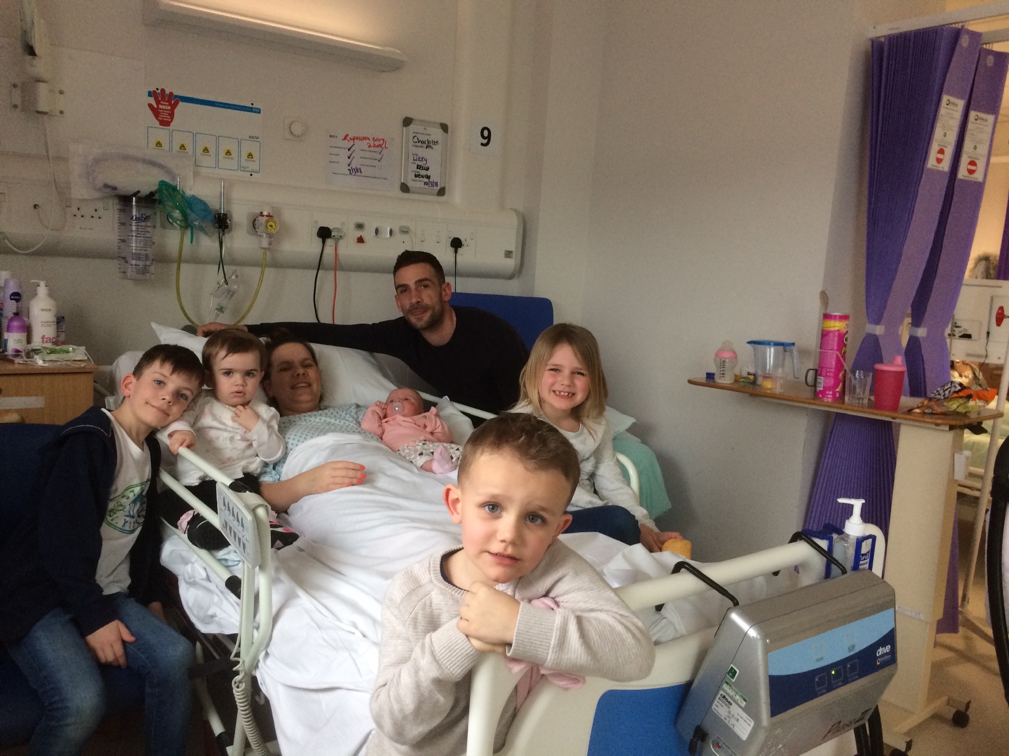 Charlotte with her family in hospital