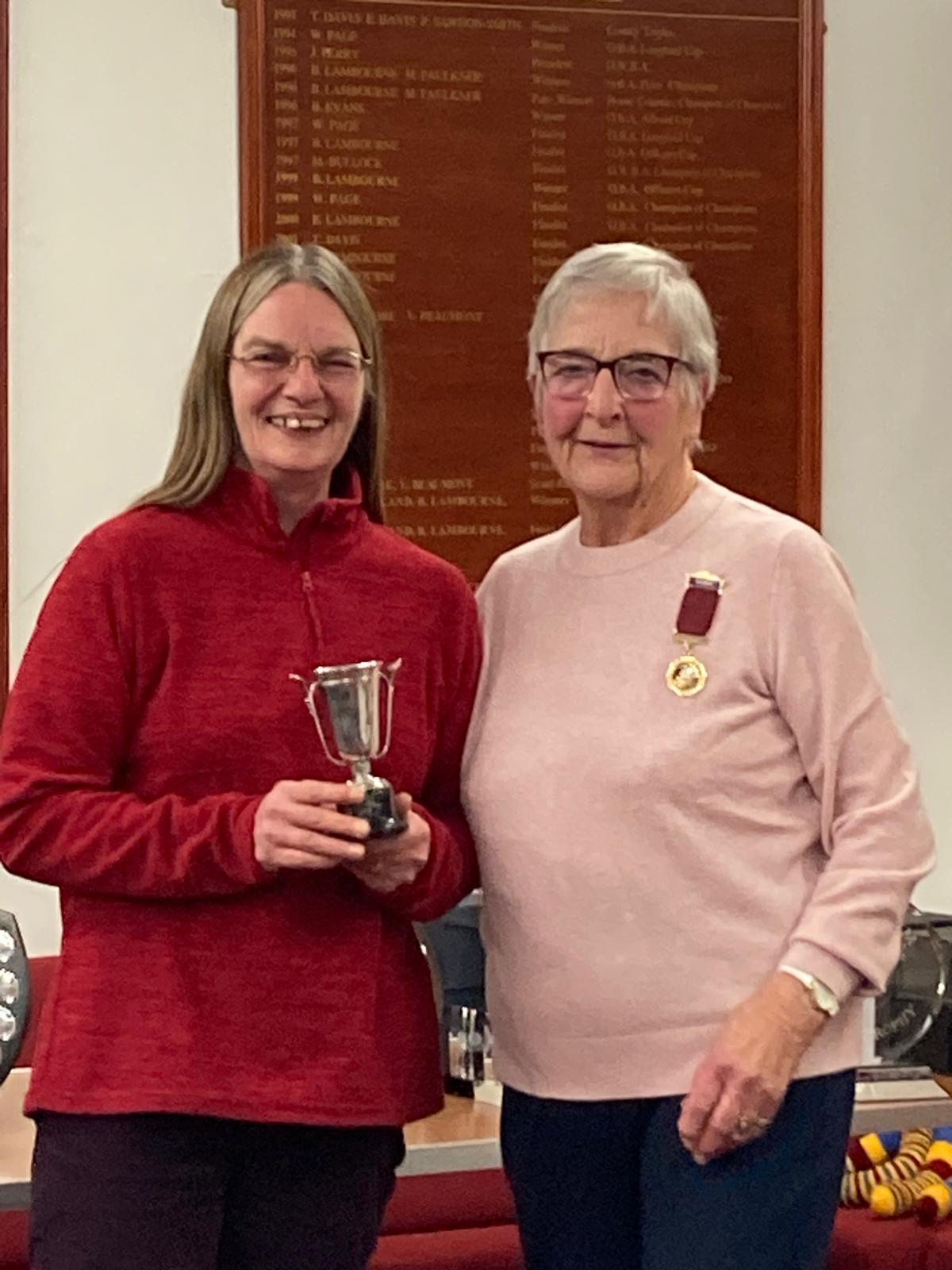 Club President Wendy Cross presents the trophy for the Novices Competition to Jane Ward