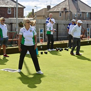 Bowlers in action.