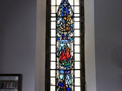 stained glass window dedicated to Iain at St John’s church, Port Ellen