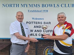 Terry Barker, Potters Bar, presents the Javis Cup to Northaw & Cuffley Captain