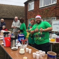 Cllrs and Clerk, in costume, serving hot drinks at The Allens
