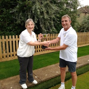 Runner Up Tony Ansell presenting Open Singles trophy to winner Colleen Laker