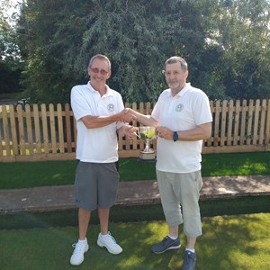 Men's 2 wood runner up James Murphy presenting trophy to winner Jonny Abbott