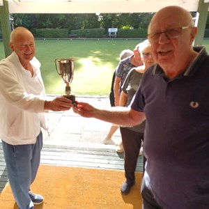 Men's captain accepting the Palmart Cup