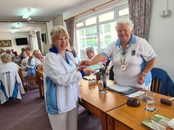 Our Shelly Rindsland receiving her County Badge from President Julie Hawkins