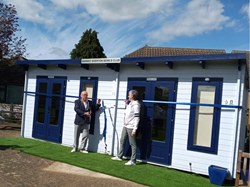 President Dave Edwards opening our new cabin, with the help of Club Captain Liz Dyer