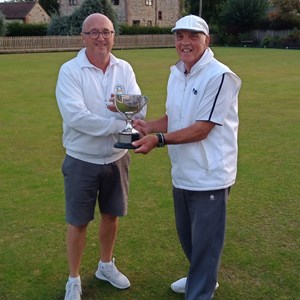 Men's 2 wood winner Richard lambert receiving trophy from runner up Bruce Acock (on right)