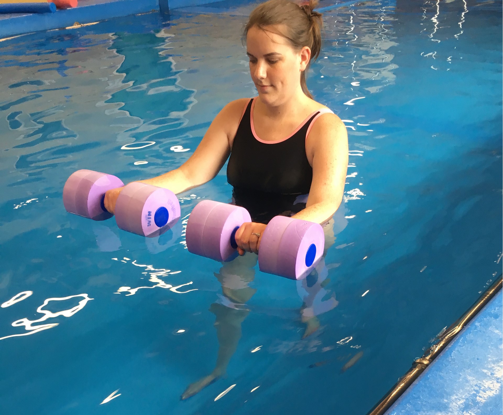 Charlotte exercising in the pool