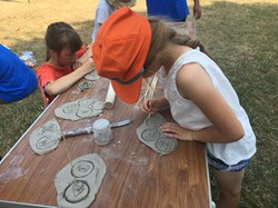 Children playing with clay at Play Scheme