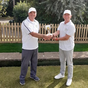 Men's club champion Bruce Acock (on left) receiving trophy from runner up Kevin Thomas